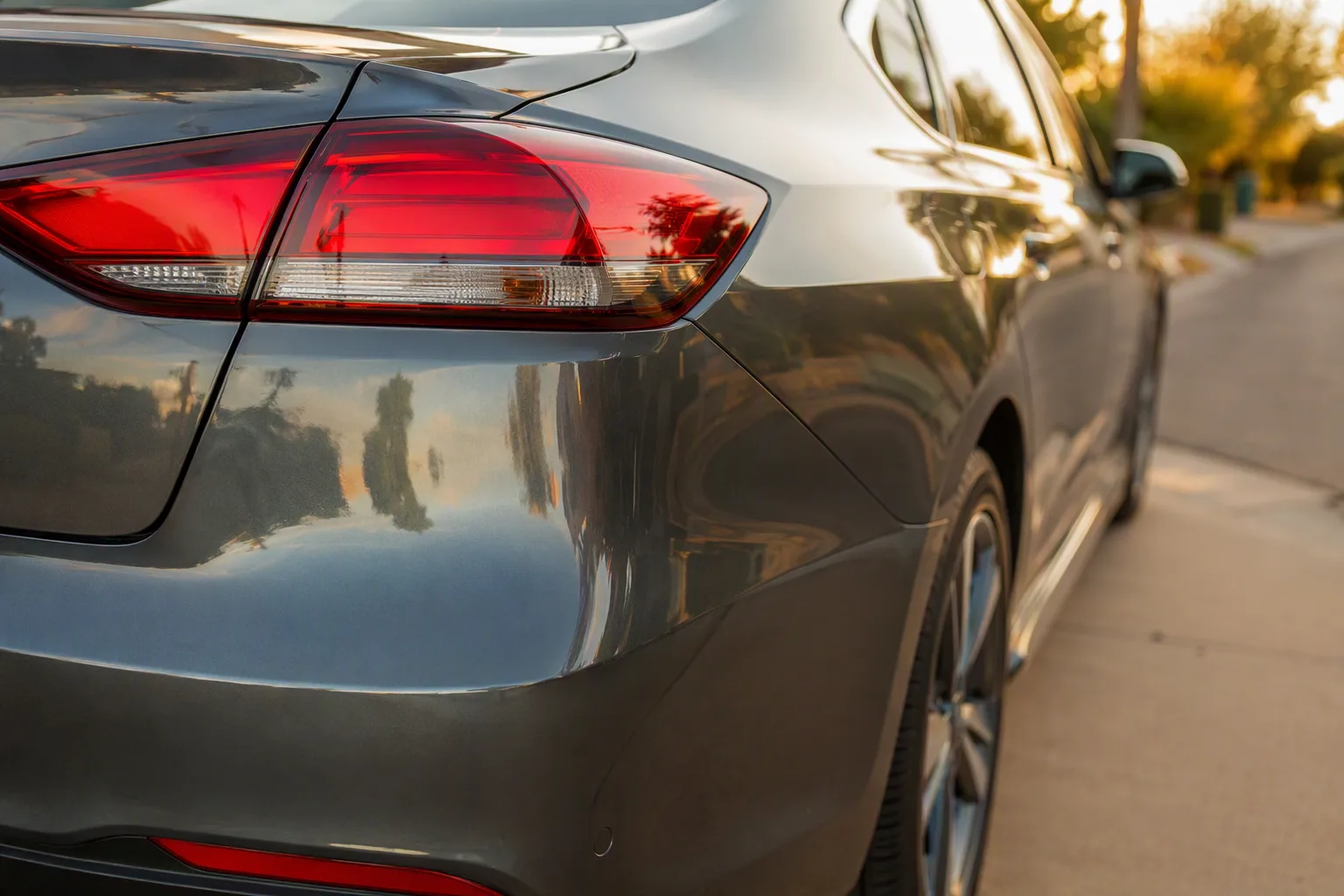 Detail close-up of freshly completed auto body repair work, clean and precise, shallow depth of field, no people in frame